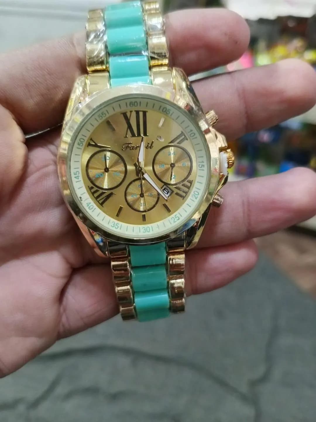 Gold Chronograph Watch with Turquoise Strap & Roman Numerals